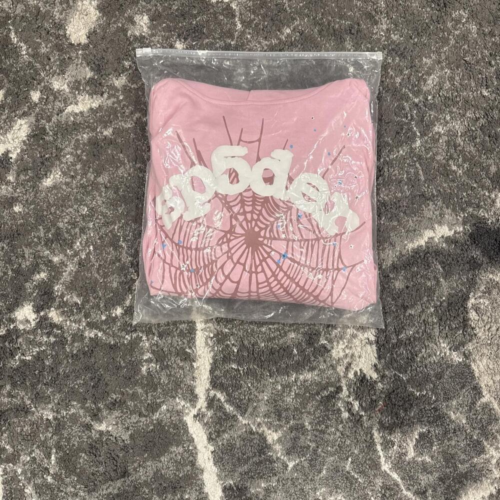 Pink Spider Worldwide hoodie with white spiderweb graphic and 'sp5der' text #spi